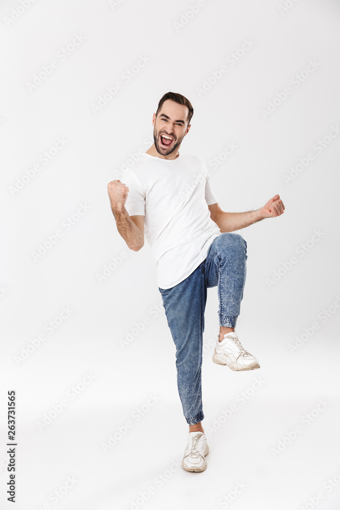 Full length of a handsome cheerful man