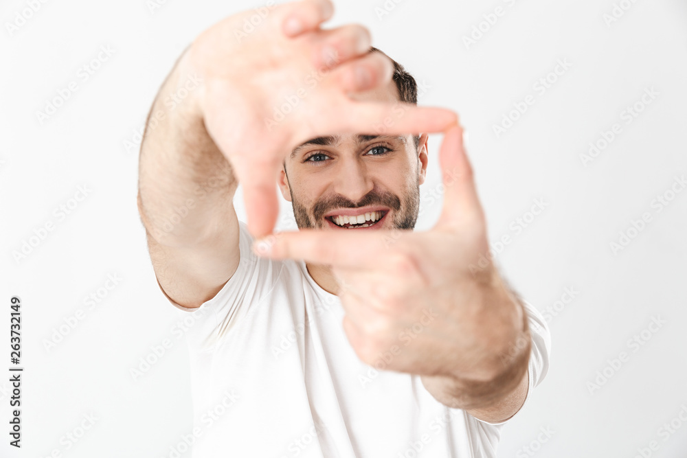 Fototapeta premium Handsome cheerful man wearing blank t-shirt