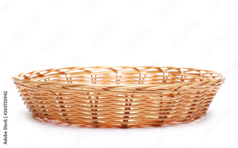 Empty new wooden wicker basket isolated on white background
