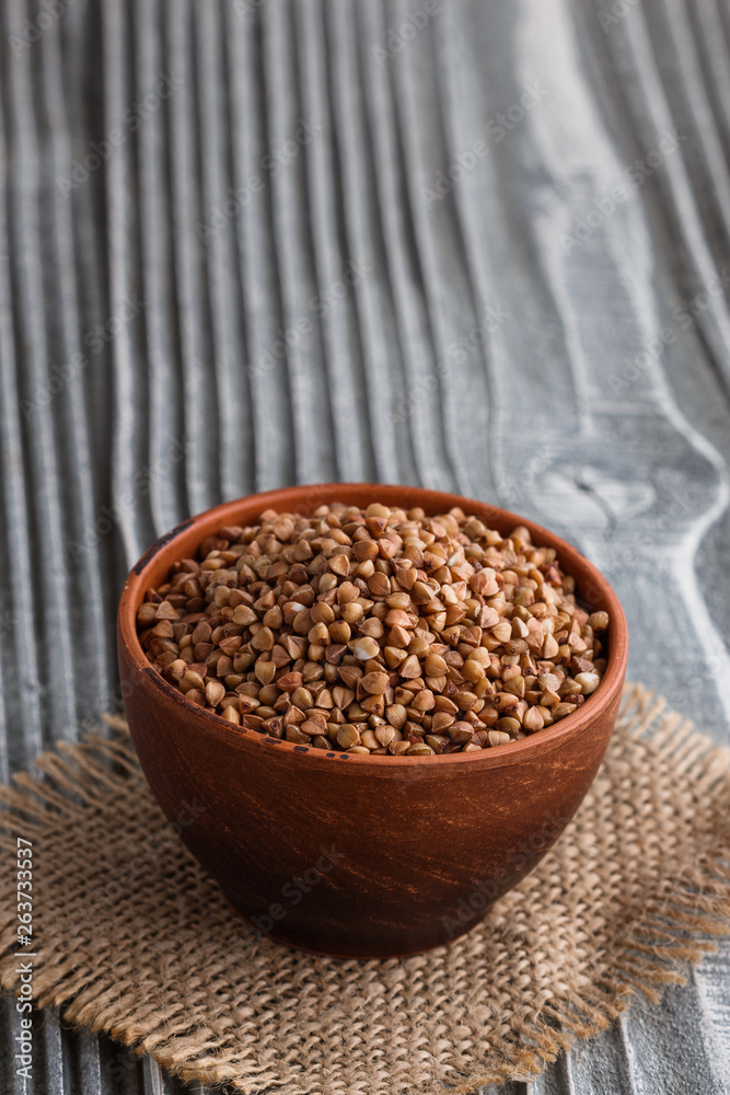 Grain buckwheat on a gray wooden background Grain buckwheat on a gray wooden background