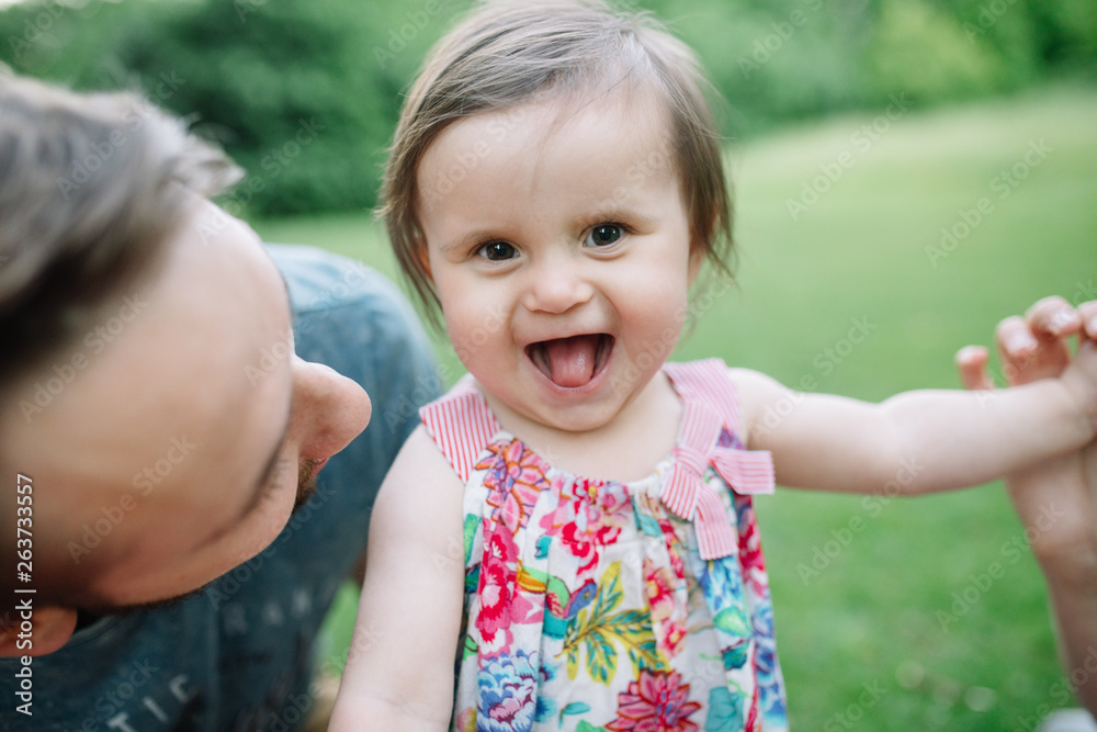 Baby with a very happy smile enjoying father daughter time Baby with a very happy smile enjoying father daughter time