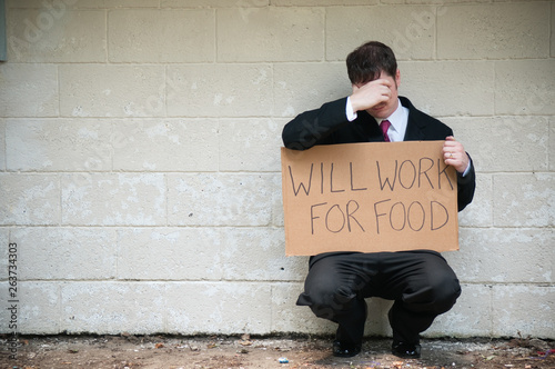 Businessman Holding Will Work For Food Sign on Street Corner, Homelessness, Poverty, Unemployment