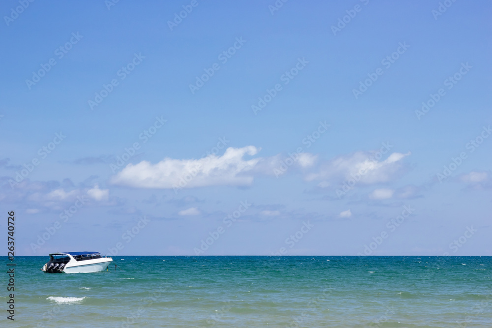 Speedboat is floating over the sea with blue sky and cloud in summer in Koh Mak Island at Trat, Thailand.