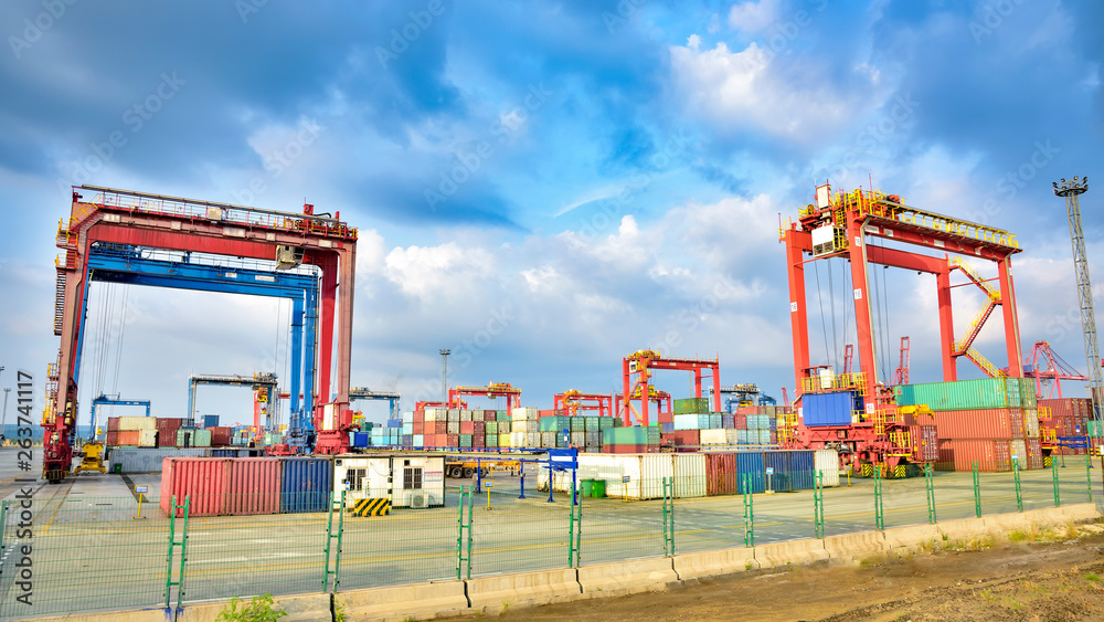 Port container cranes in the background of blue sky white clouds Port container cranes in the background of blue sky white clouds