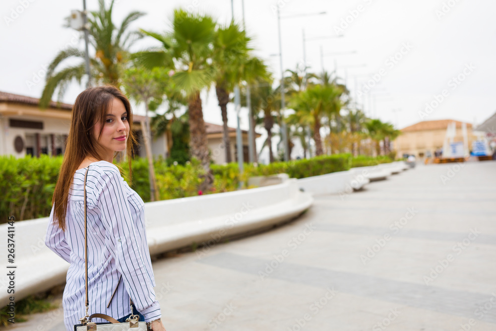 young woman walking in the city