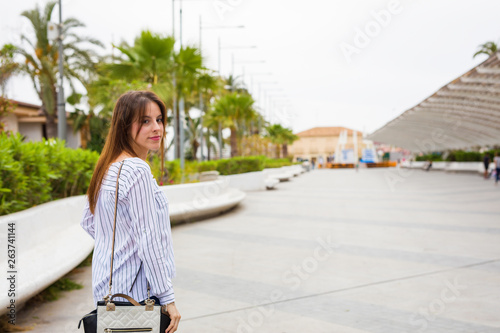 young woman walking in the city