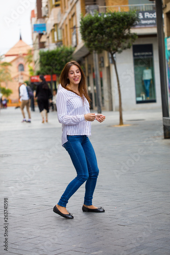 young woman jumping in the city