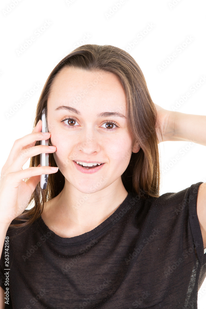 Young woman using a mobile phone smartphone on white background Young woman using a mobile phone smartphone on white background