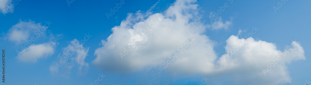Beautiful panoramic vivid vibrant blue sky with white clouds on a sunny day for web banner. Beautiful panoramic vivid vibrant blue sky with white clouds on a sunny day for web banner.