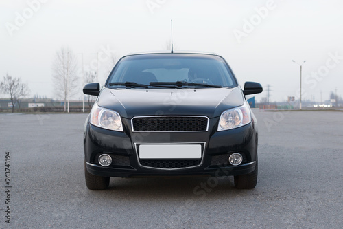 Black color new model car front view on parking photo