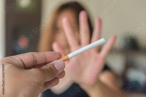 Asian woman make hand Refuse cigarette.Quitting from addiction concept,No tobacco day,No smoking concept,Just say no