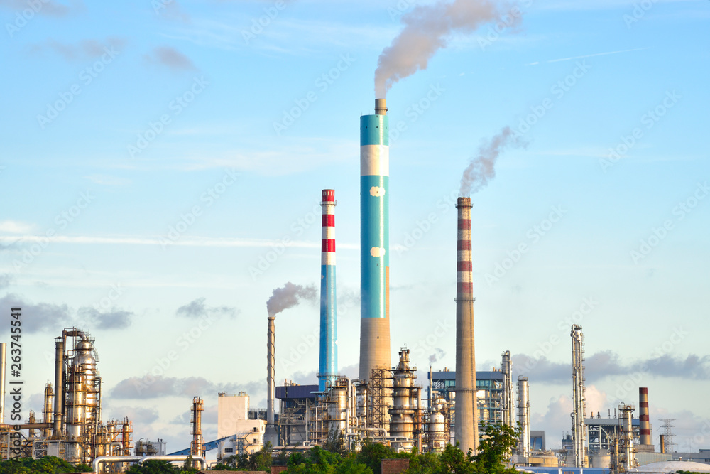 Fototapeta premium Oil refineries and power plants under the blue sky white clouds