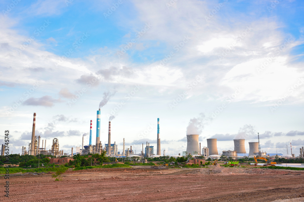 Oil refineries and power plants under the blue sky white clouds Oil refineries and power plants under the blue sky white clouds