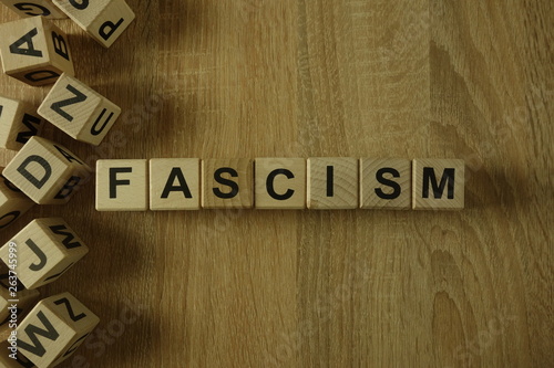 Fascism word from wooden blocks on desk photo