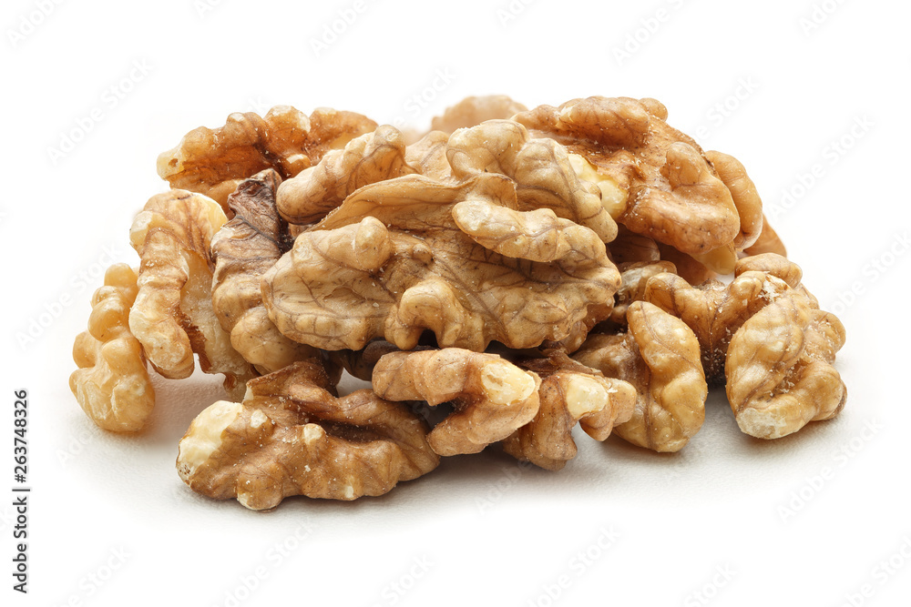 Pile of peeled walnuts isolated on white background. Walnuts kernel closeup. Pile of peeled walnuts isolated on white background. Walnuts kernel closeup.