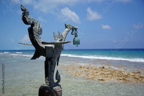 statue on island in sea