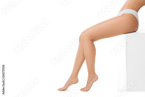 cropped women's legs with soft and smooth skin. Hair removal, care about legs