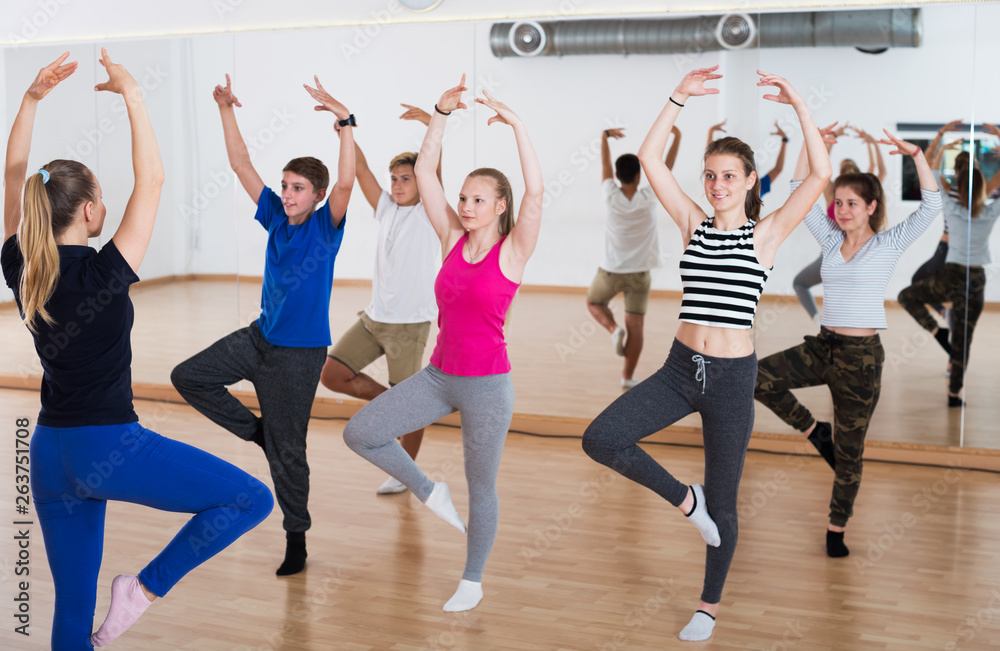 Dance teacher demonstrates new position