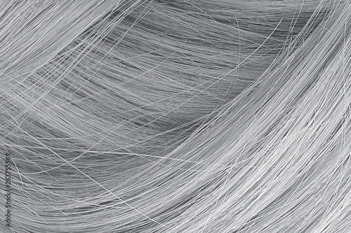 Gray hair as background, texture. One of the popular shades of hair coloring photo