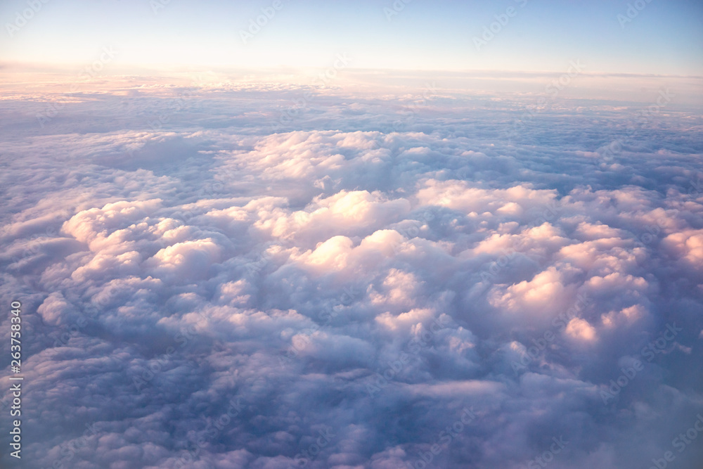 view sky and clouds from an airplane. flying above the clouds.