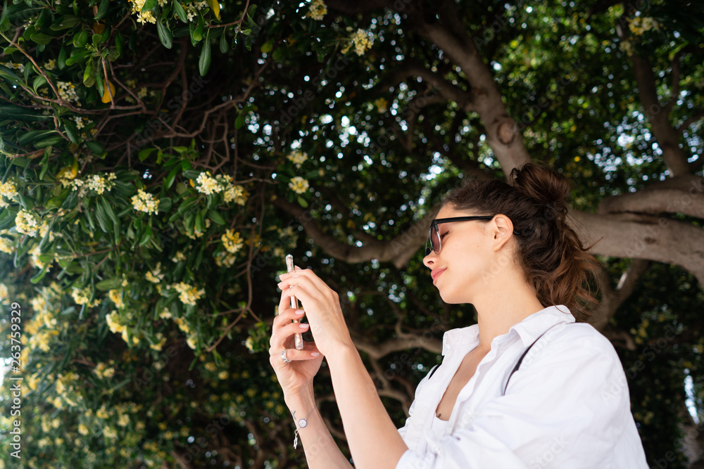 beautiful young girl posing on the background of evergreen tree beautiful young girl posing on the background of evergreen tree