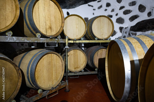 Wooden Barrels in Oak Stored At Wine Cellar Below Ground © kjekol