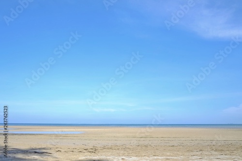 Fototapeta Naklejka Na Ścianę i Meble -  A beautiful sea beach with water waves and a horizontal line,blue sky in bright day