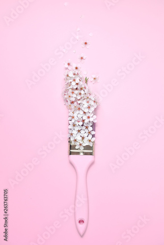Creative composition. Paintbrush With Blossoms on pink background. Flat lay, top view, copy space © Yura Yarema