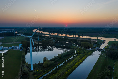 Wind turbines generating green energy during sunset as seen from above in Waalwijk  Noord Brabant  Netherlands