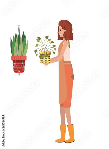 woman with houseplant on macrame hangers