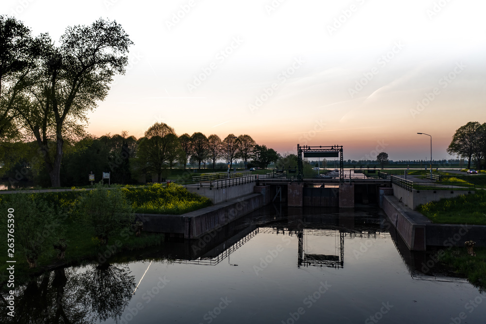 A small water lock in a canal near Waalwijk, Noord Brabant, Netherlands