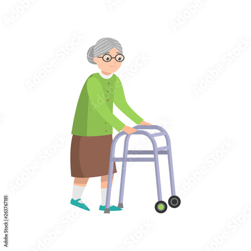 Senior old woman in green clothes walking with walker