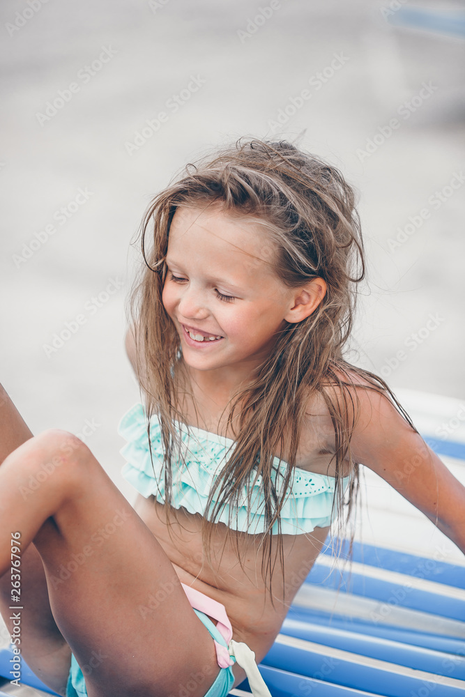 Portrait of beautiful girl on the beach dancing