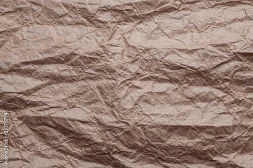 Crumpled kraft paper. Texture crumpled recycled old paper.