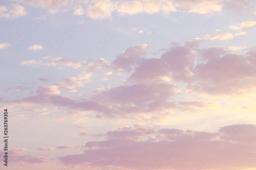 Pink, blue, purple evening sunset sky with cumulus clouds