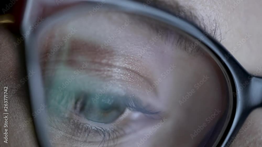 Close up footage of display light reflections on eyeball.