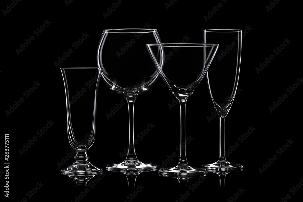 Glassware silhouettes on black.