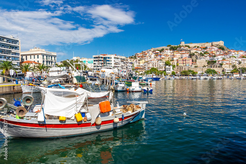 Boats at the Port of Kavala, Eastern Macedonia, Northern Greece and view of the old town in the background
