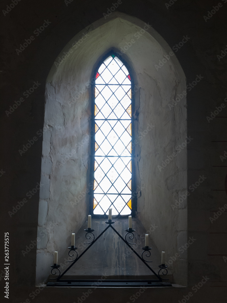 beautiful church window inside with candles space Christian