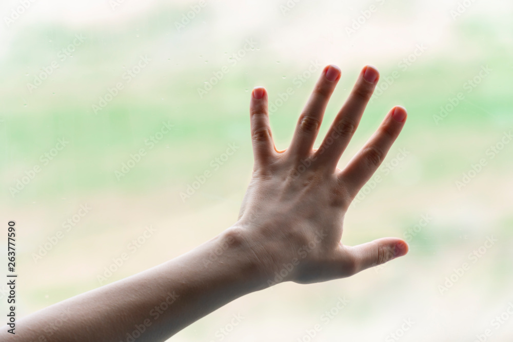 Hand of woman in gesture isolated on blurred background Hand of woman in gesture isolated on blurred background