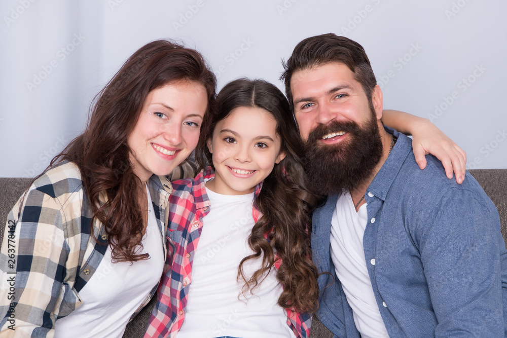 Friendly family sit couch posing for photo family album. Mom dad and daughter smiling relaxing on couch. Family bonds concept. Typical family with single child. Family spend weekend together