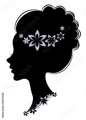 Silhouette profile of a cute lady's head. The girl has long beautiful hair, decorated with purple flowers. Suitable for advertising, logo. Vector illustration.