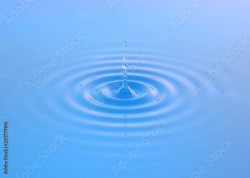 Fresh water drop splash with water droplets on light background. Liquid water template design element. Healthy food, ecology and water balanced diet concept. Minimal 3D illustration
