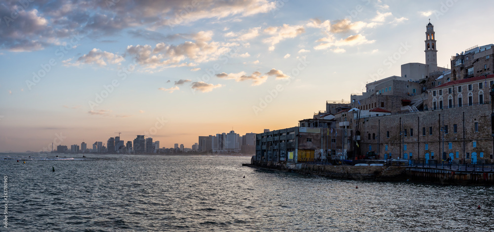 Beautiful panoramic view of a Port of Jaffa during a colorful sunrise. Taken in Tel Aviv-Yafo, Israel.