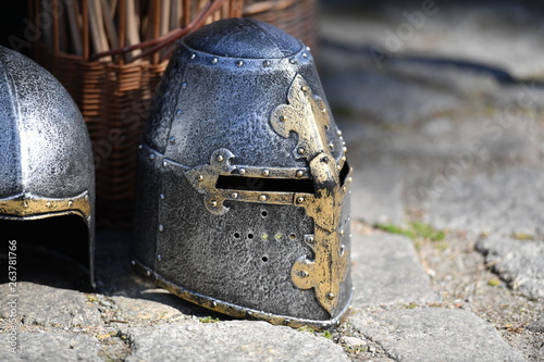 A shiny knight helmet on a traditional market.