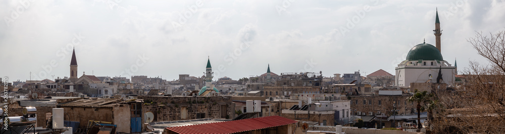 Aerial panoramic view of the Old City of Akko during a cloudy and sunny day. Taken in Acre, North District, Israel.