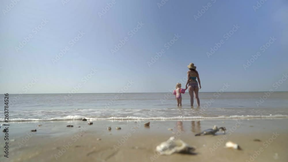 Mother and young Daughter jumping over the waves - SEA / BEACH | 4K - Realistic Style Mother and young Daughter jumping over the waves - SEA / BEACH | 4K - Realistic Style