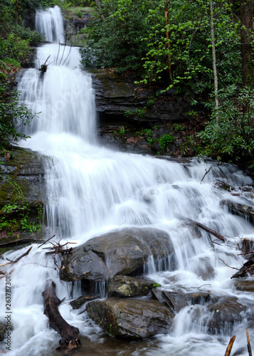 DeSoto Falls waterfall in the northern Georgia mountains overflowing with water and rushing fast after much rainfall.