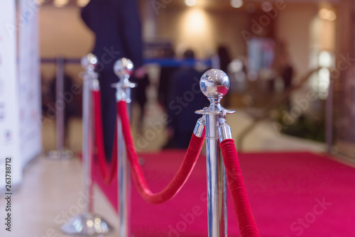 Obraz na plátně Silver stanchions with a red rope