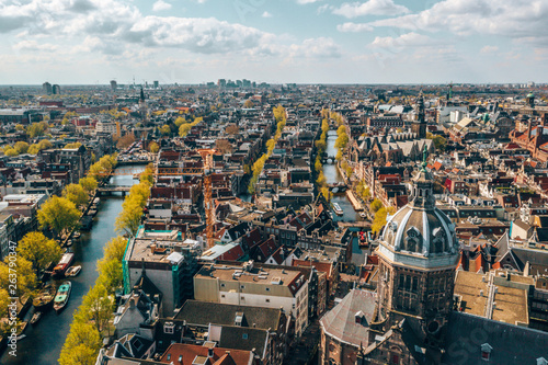 Photography Beautiful aerial Amsterdam view from above with many narrow canals, streets and architectures
